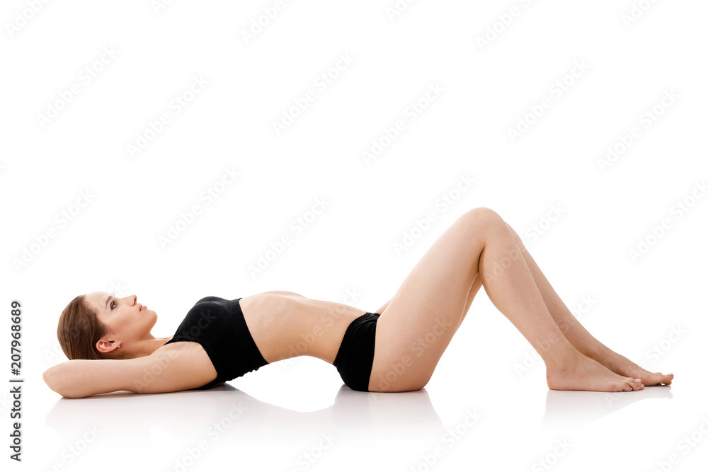 woman with long slender legs in black underwear woman with long slender legs in black underwear