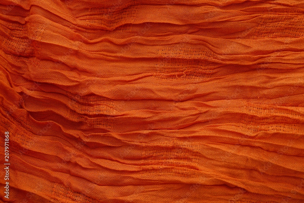 red texture of a piece of crumpled cloth on clothes