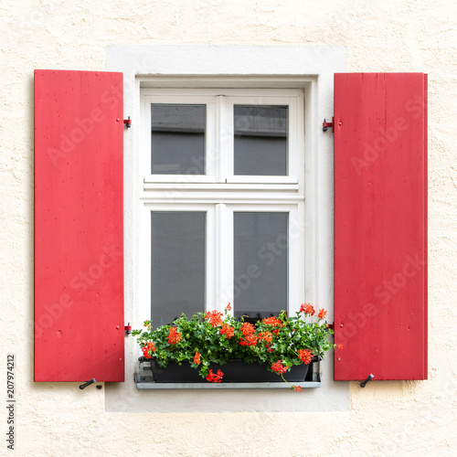 red wooden window exterior