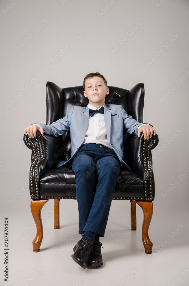 child in the Studio posing in fashionable clothes