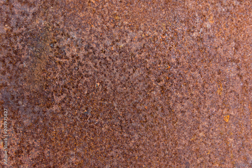 Brown rust stains texture of the old white paint on rusty metal wall. Rusty metal background. Brown rust stains texture of the old white paint on rusty metal wall. Rusty metal background.