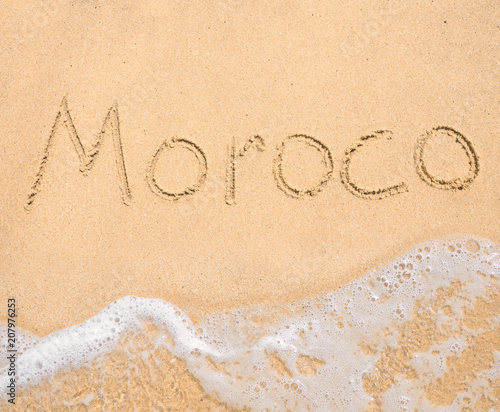 The word Moroco written in the sand on beach © arttim