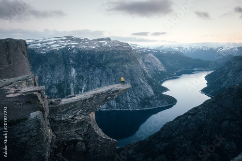 Obraz na plátně Alone tourist on Trolltunga rock - most spectacular and famous scenic cliff in N