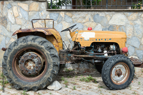 Old vintage tractor in the village 