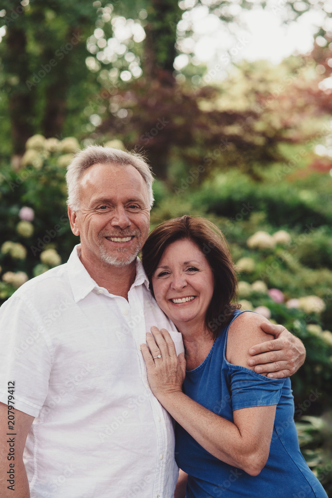 An attractive couple in their 50s poses for engagement photos An attractive couple in their 50s poses for engagement photos