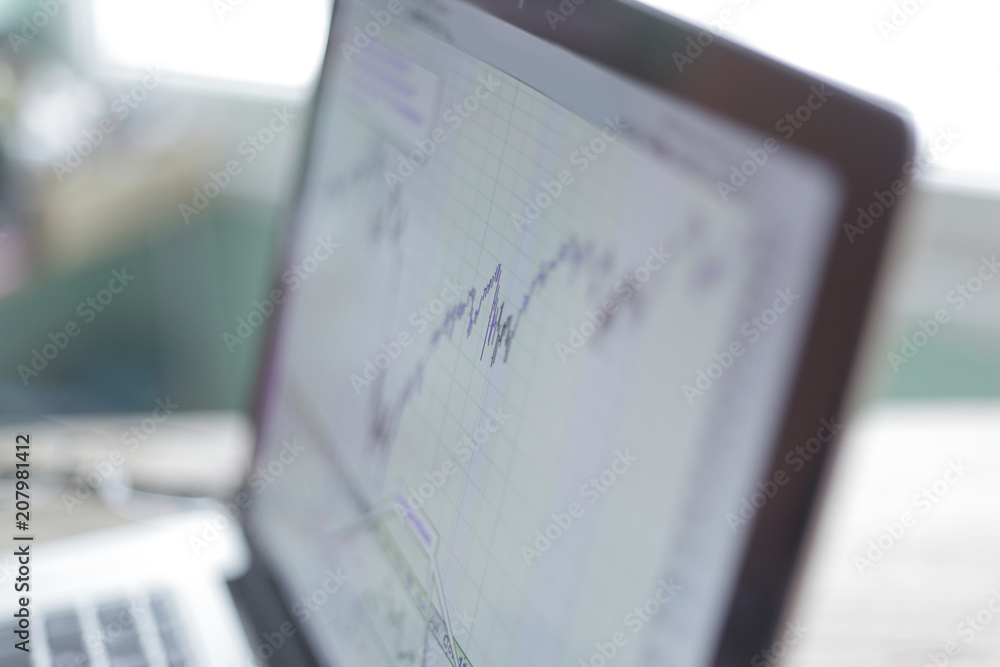 laptop with financial chart on the screen.close up laptop with financial chart on the screen.close up