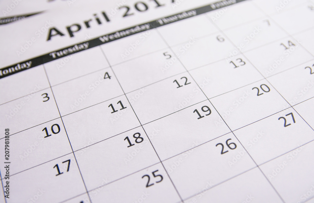 Close up calendar of page April background, Tax season Close up calendar of page April background, Tax season
