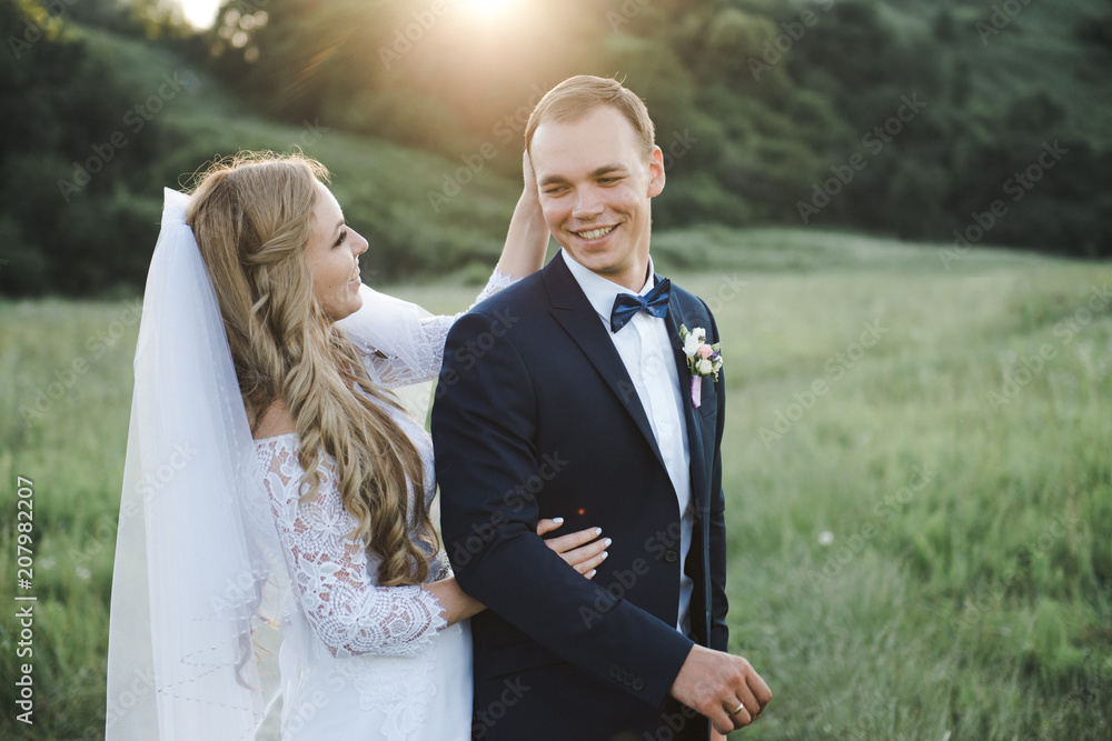 Wedding in the mountains. The bride and groom at sunset. Wedding in the mountains. The bride and groom at sunset.