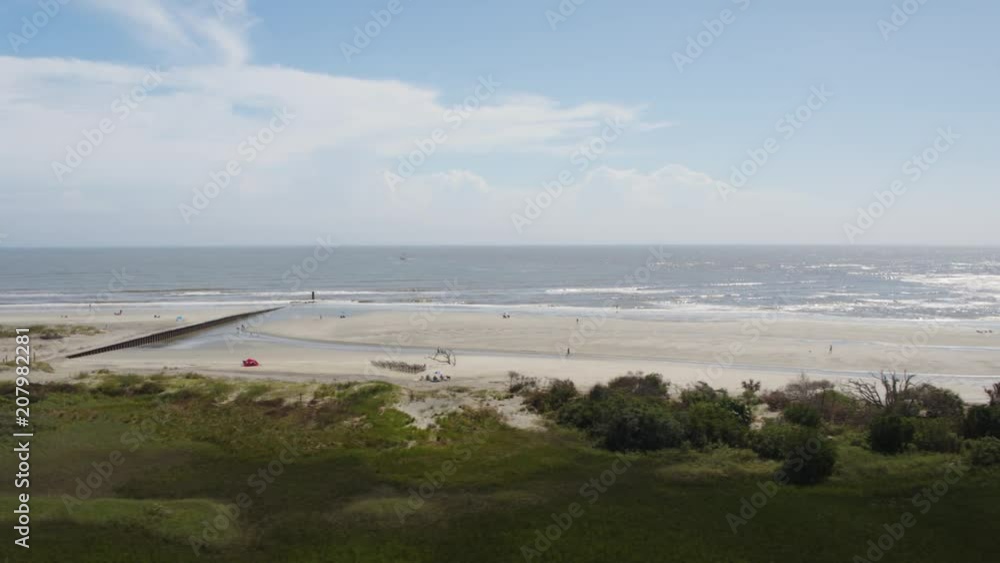 South Carolina Charleston Folly Beach Aerial v64 Flying low over Folly Beach shore panning inland 10/17 South Carolina Charleston Folly Beach Aerial v64 Flying low over Folly Beach shore panning inland 10/17