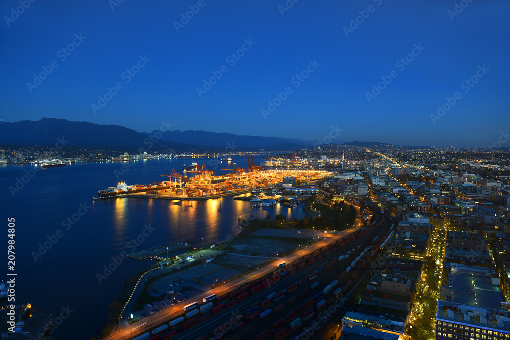 Port of Vancouver district at night, photo taken from the Harbour Centre tower in Vancouver, British Columbia, Canada.