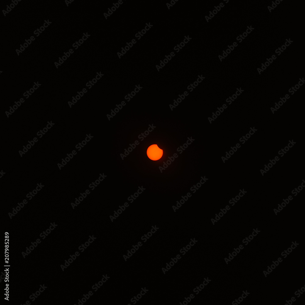 Distant sun during a partial solar eclipse. Distant sun during a partial solar eclipse.