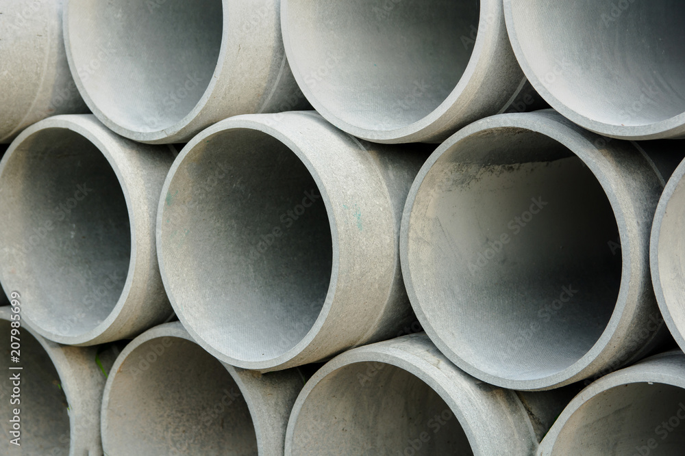 Close up concrete, cement pipes stacking, pattern background. concrete pipes for irrigation Close up concrete, cement pipes stacking, pattern background. concrete pipes for irrigation