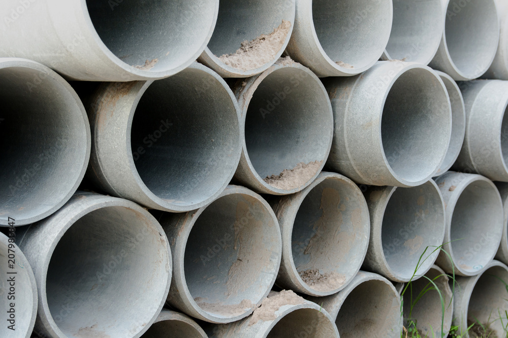 Close up concrete, cement pipes stacking, pattern background. concrete pipes for irrigation Close up concrete, cement pipes stacking, pattern background. concrete pipes for irrigation