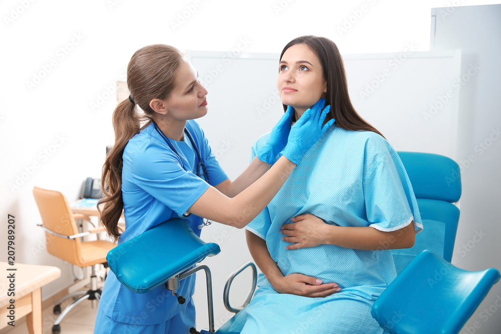 Pregnant woman having appointment at gynecologist office Pregnant woman having appointment at gynecologist office