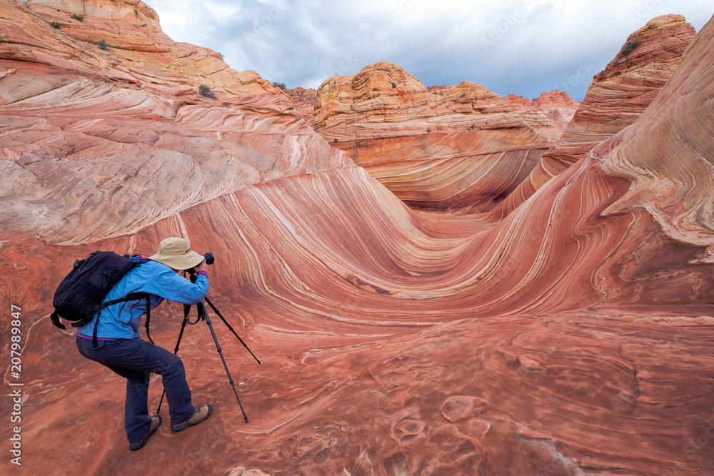 Fotografie Photographer at the Wave