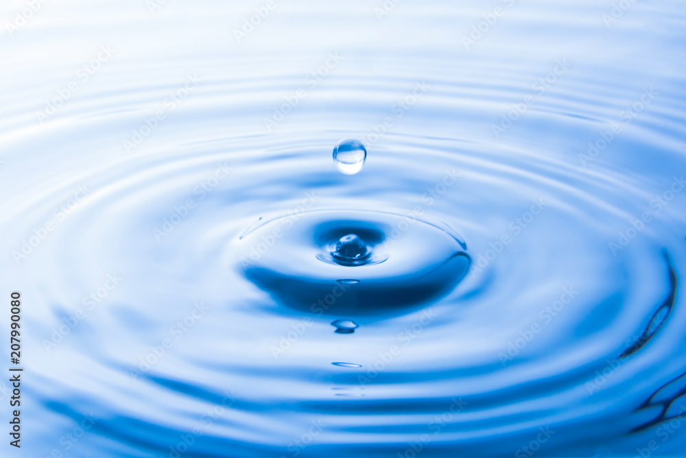 Water drop falling into water make waves. Water splash or water drop background. Water drop falling into water make waves. Water splash or water drop background.