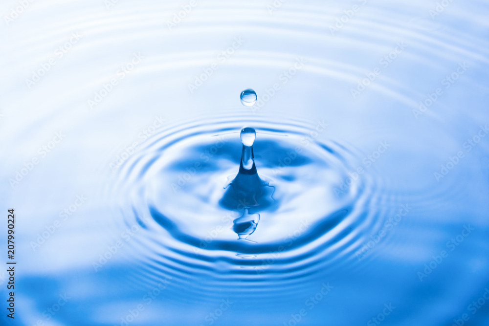 Water drop falling into water make waves. Water splash or water drop background. Water drop falling into water make waves. Water splash or water drop background.