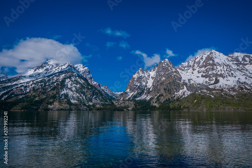 Beautiful landscape view of snow capped mountain  grand Tetons reflecting on water