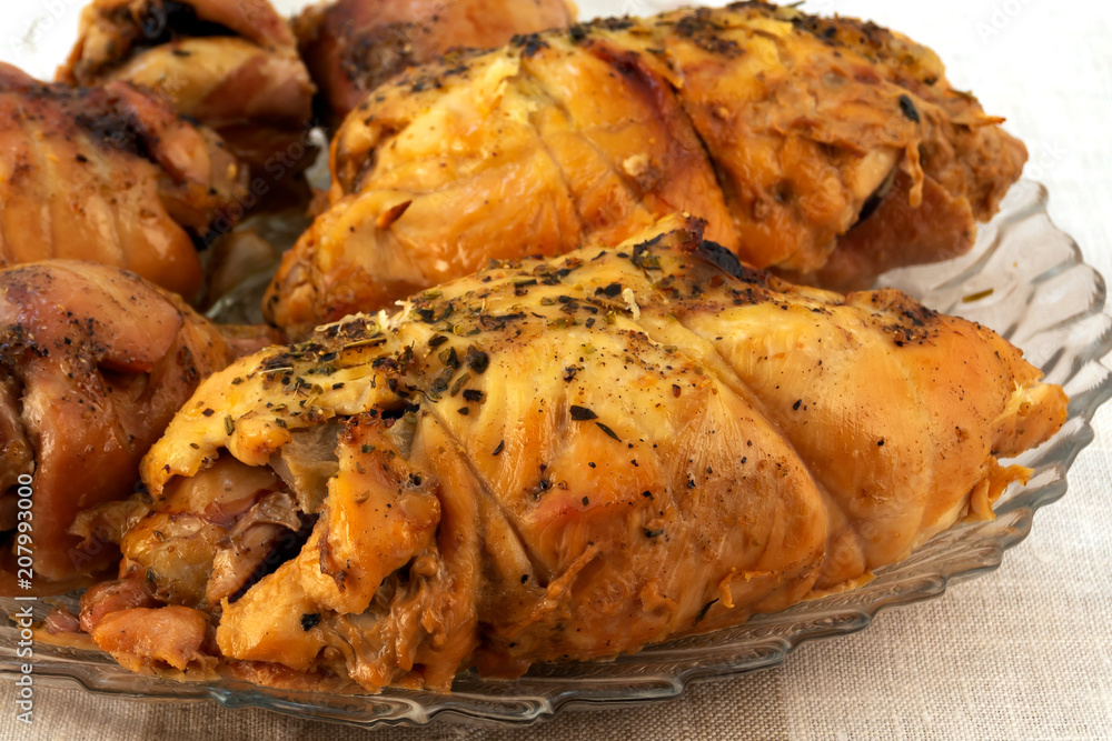 Meat dish - baked rolls, twisted from slices of meat, laid on a glass plate. Meat dish - baked rolls, twisted from slices of meat, laid on a glass plate.