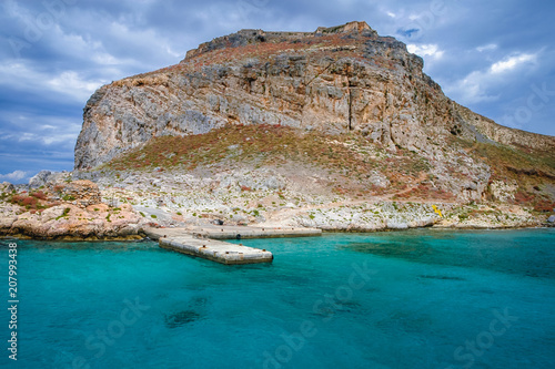 Imeri Gramvousa Island with ruins of Venetian fort on a Mediterranean Sea near island of Crete, Greece photo