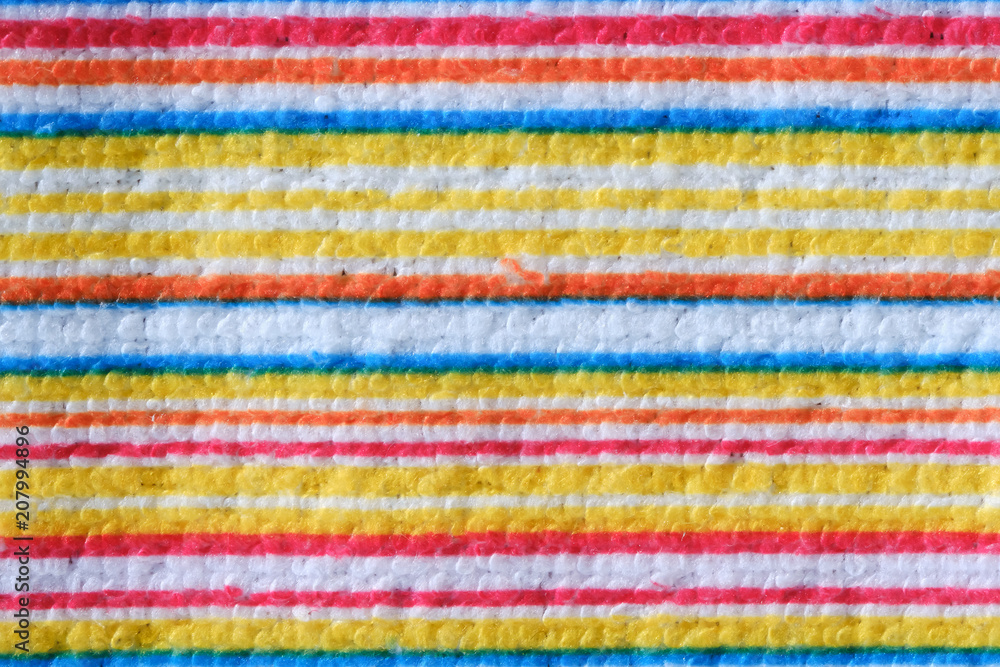 Striped beach towel useful as a background pattern