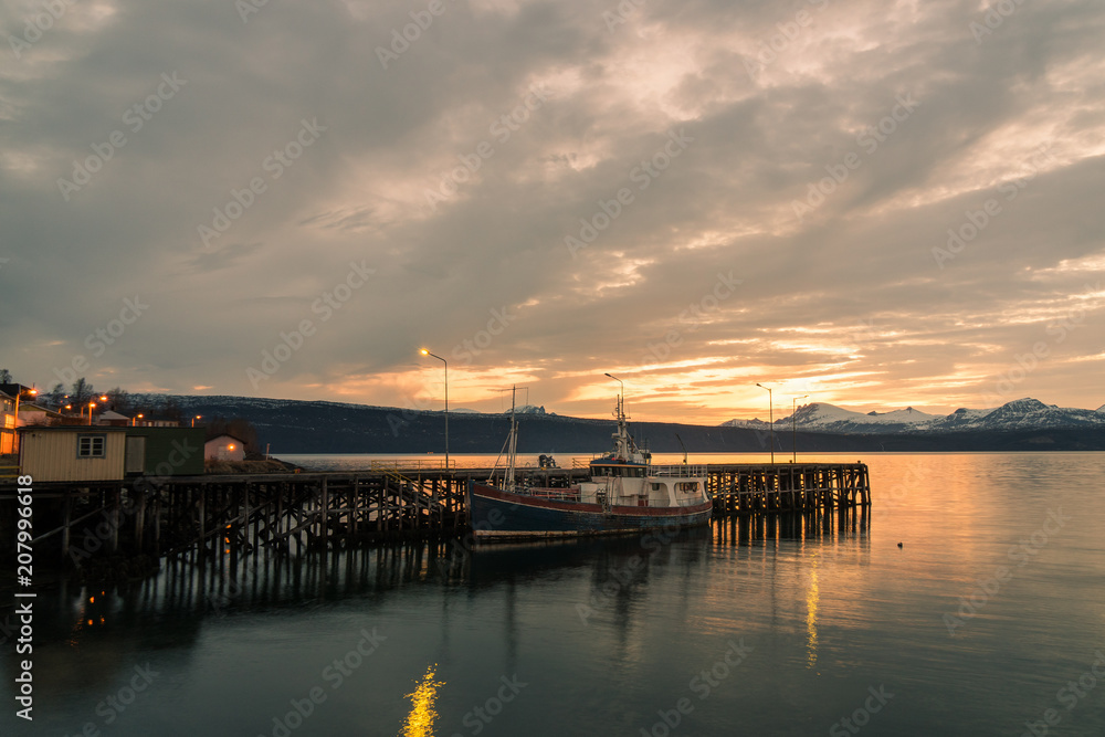 landing stage at a small harbour in Narvik / Norway at midnight with midnight sun