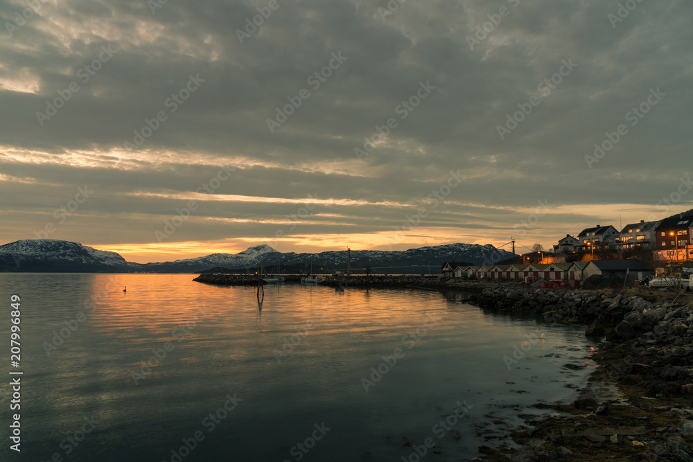 landing stage at a small harbour in Narvik / Norway at midnight with midnight sun