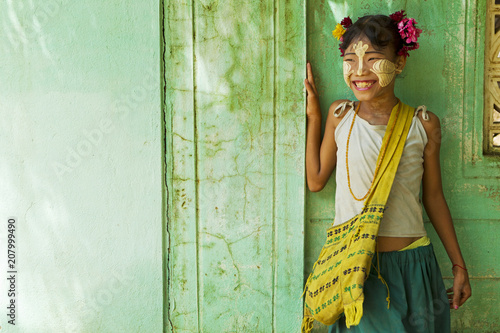 Young burmese girl with Tanaka on her face