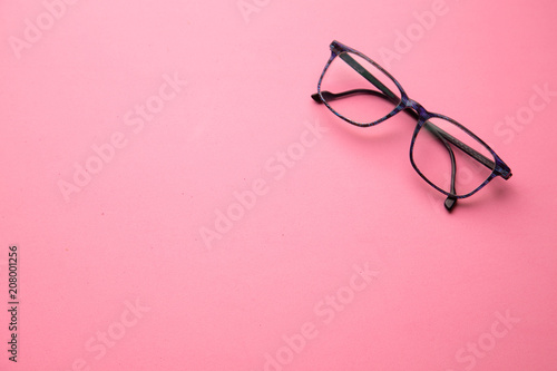 graduated glasses on pink background