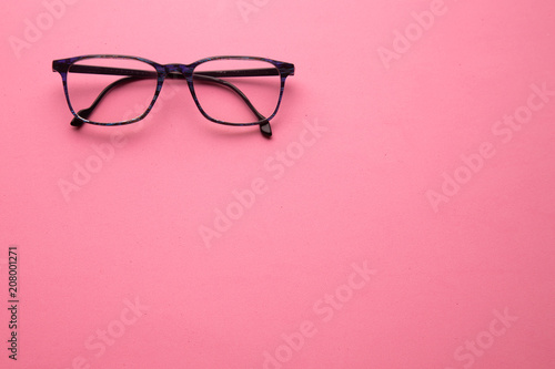 graduated glasses on pink background