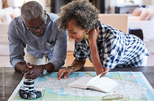 African American Senior Couple planning a trip in retirement photo