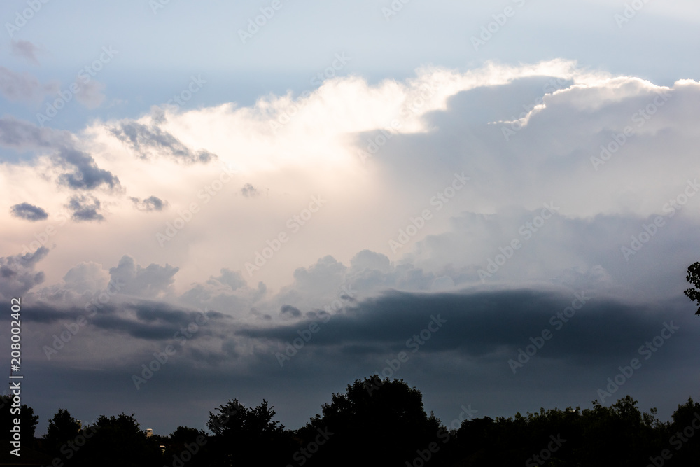 Close-up of cumulus clouds forming with silver lining