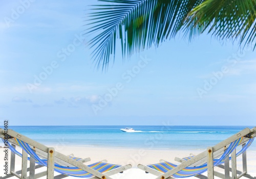 Comfortable beach chair at sea shore. Vacation concept.Sand beach and Beautiful sea background in summer.