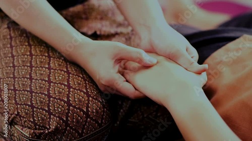 Traditional Thai massage or Thai yoga massage treatment involve working and acting on the body with pressure. Its is usually called nuat peahen thai or nuat phaen boran photo