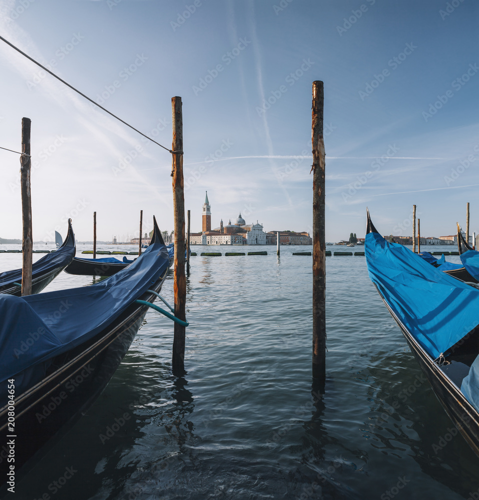 Gondolas at sunise in Venice lagoon, Italy Gondolas at sunise in Venice lagoon, Italy
