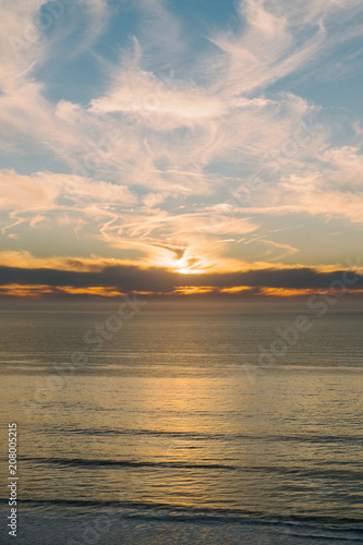 Waves at sea at sunset photo