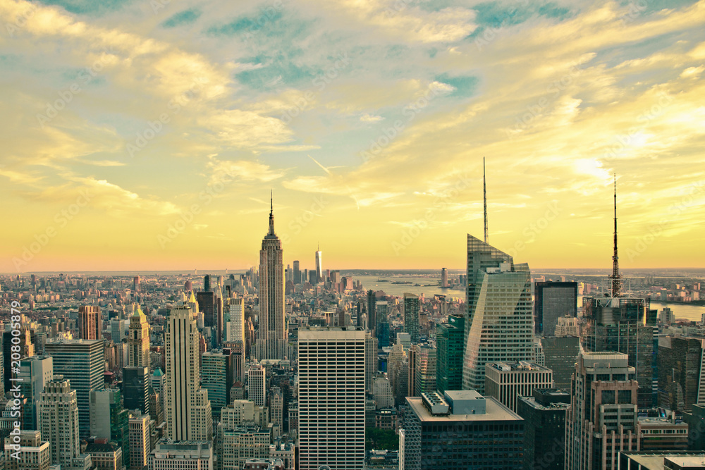 Vintage style image of buildings across New York City at sunset with retro filter 