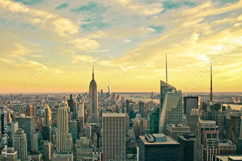 Vintage style image of buildings across New York City at sunset with retro filter 