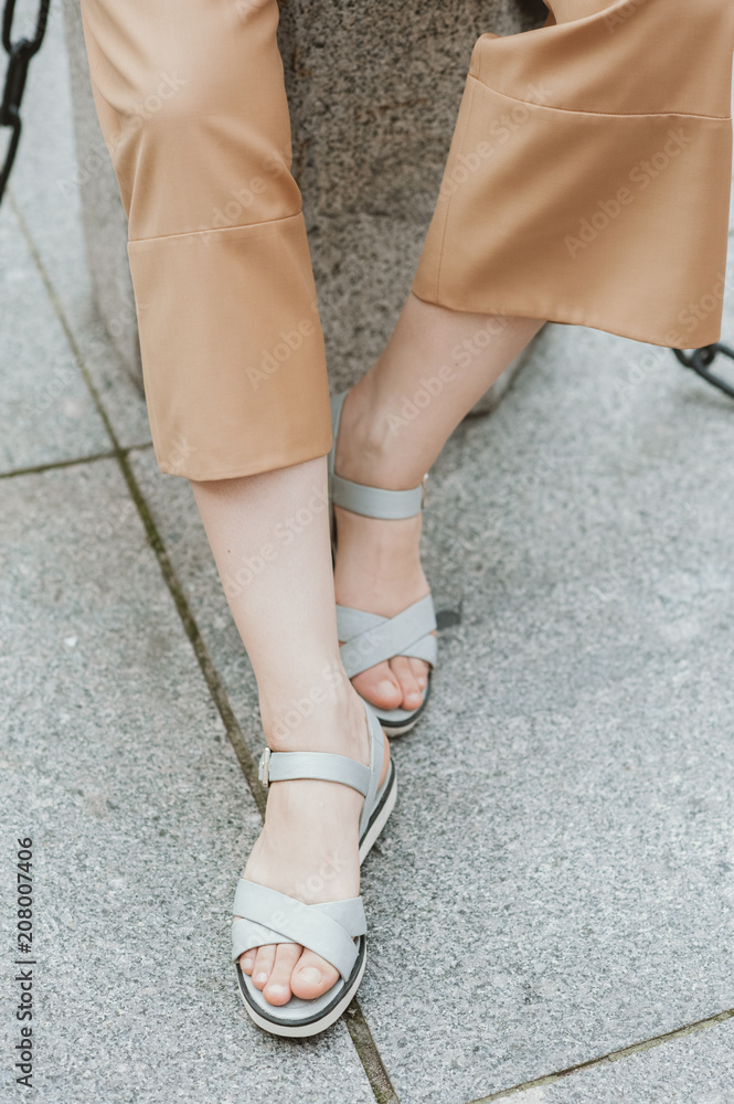 Woman wearing sandals Woman wearing sandals