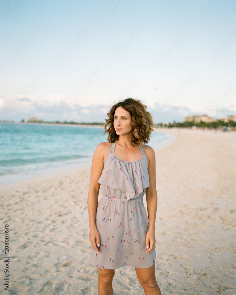 Portrait of a beautiful woman standing on a beach Portrait of a beautiful woman standing on a beach