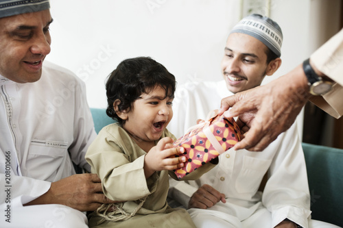 Muslim little boy with his family photo
