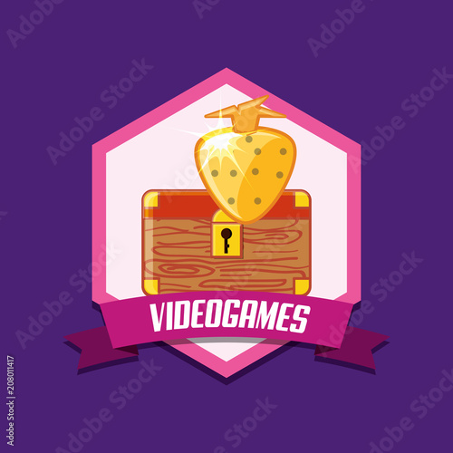 Videogame emblem with chest box and golden strawbeerry icon over purple background, colorful design. vector illustration photo