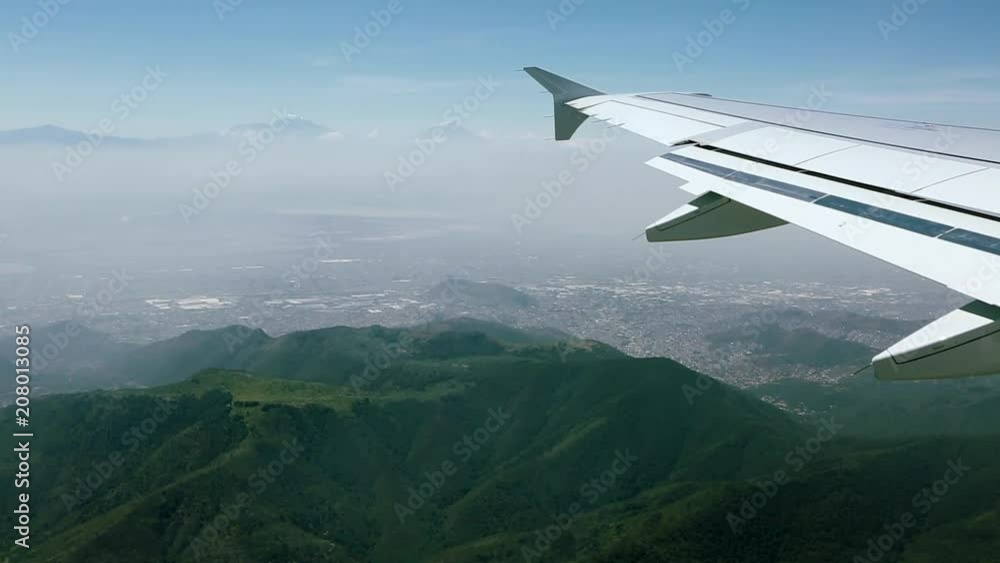 Aerial view from an airplane over mountains in Mexico City Aerial view from an airplane over mountains in Mexico City