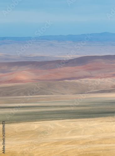 Various colours of the desert in vertical landscape shot photo