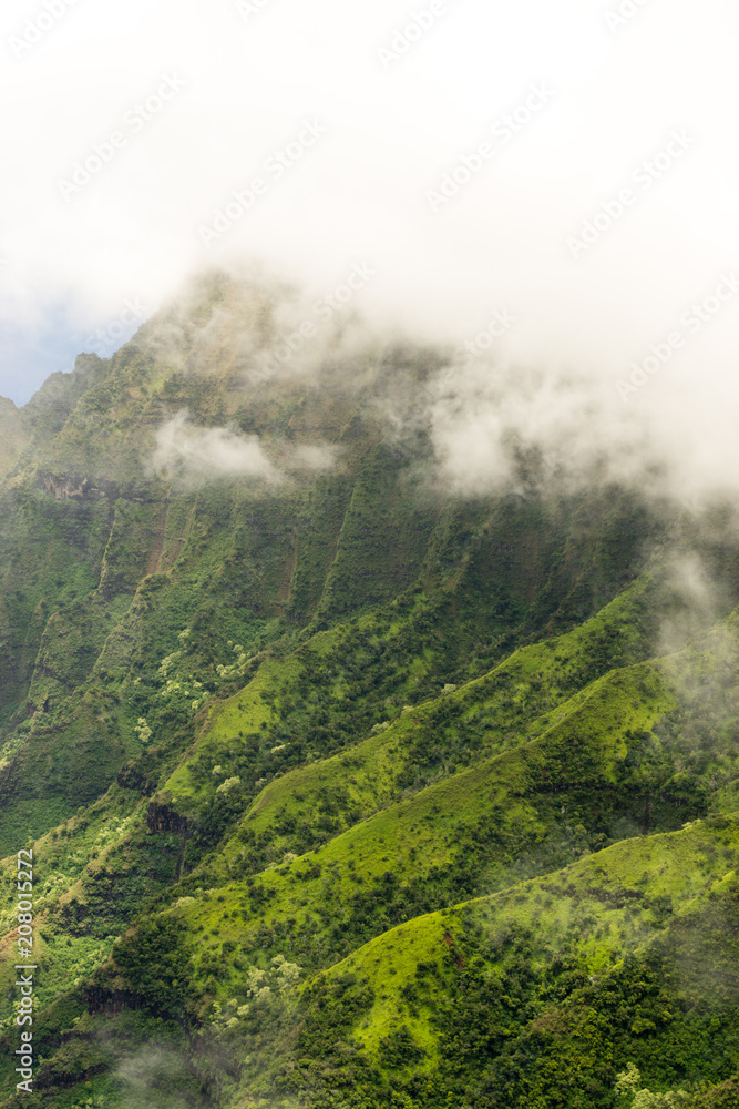 Aerial view on a overcast foggy day over Na Pali Coast in Kauai, Hawaii Aerial view on a overcast foggy day over Na Pali Coast in Kauai, Hawaii