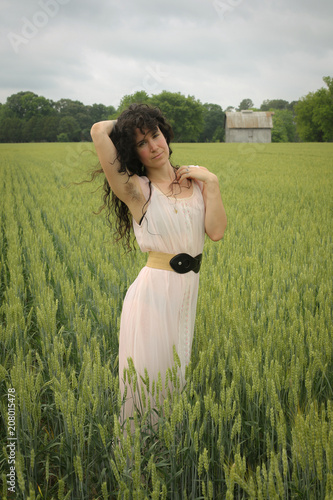 Wallpaper Mural Woman Female Model in a Wheat Field Surrounded by Trees in Spring or Summer Wearing a Pink Flowing Dress Torontodigital.ca