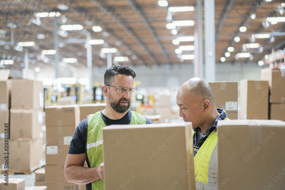 Warehouse workers in storage facilty Warehouse workers in storage facilty