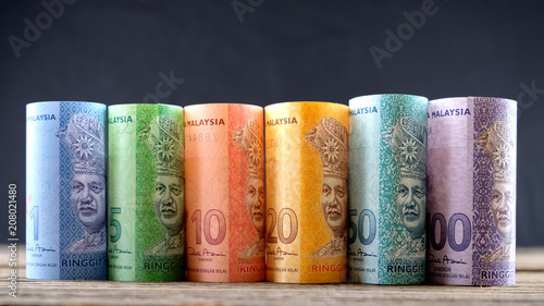 Row of Malaysia Ringgit on wooden table photo