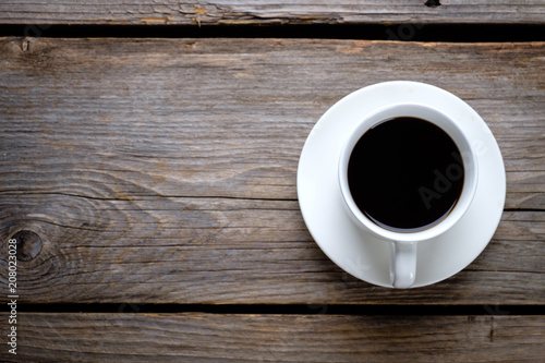 A cup of coffee on rustic wooden table