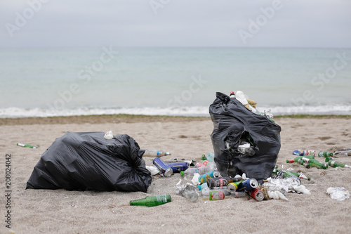 VAMA VECHE, ROMANIA - MAY 1, 2018: Garbage (especially empty bottles), after an all night party, © MoiraM